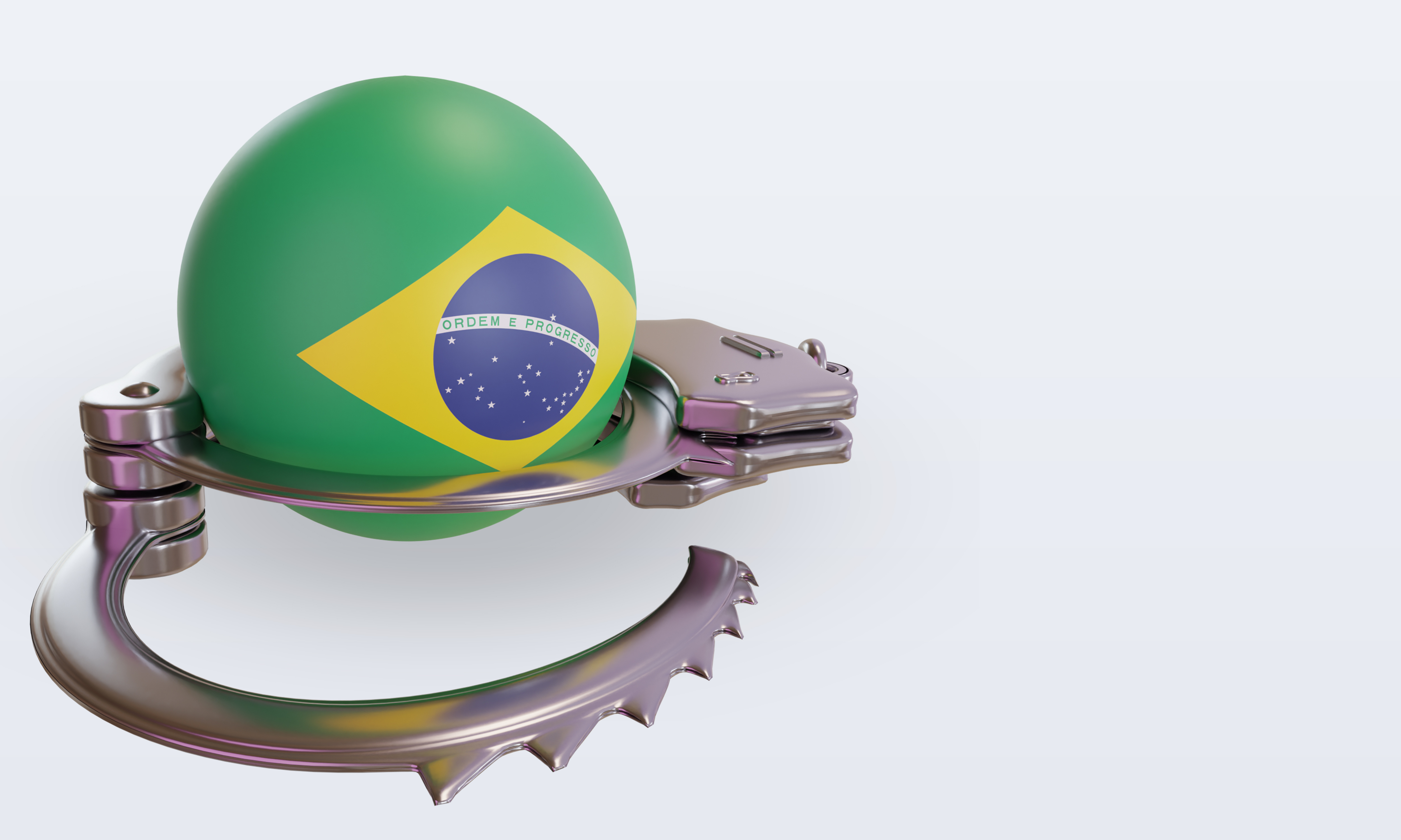 一個裝飾有巴西國旗的球被手銬包裹。